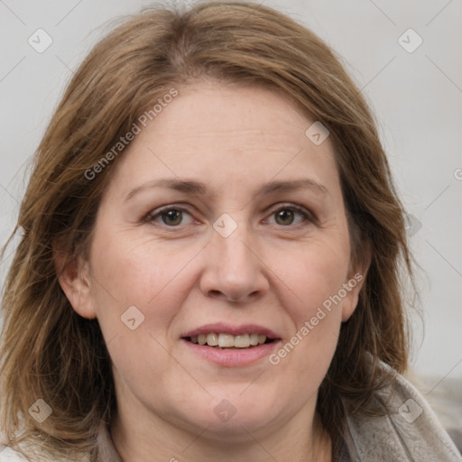 Joyful white adult female with medium  brown hair and grey eyes