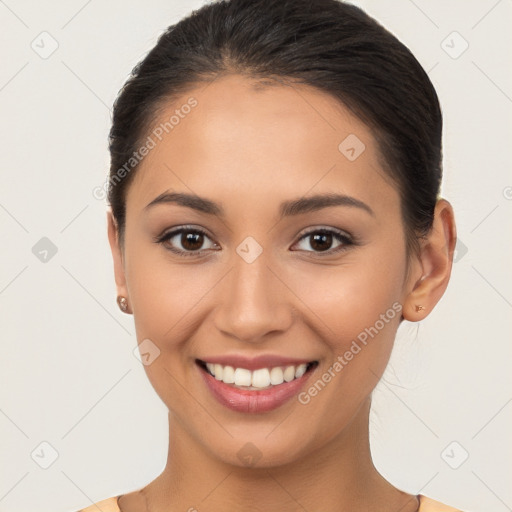 Joyful white young-adult female with long  brown hair and brown eyes