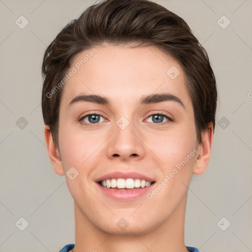 Joyful white young-adult female with short  brown hair and grey eyes