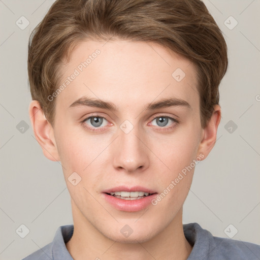 Joyful white young-adult male with short  brown hair and blue eyes