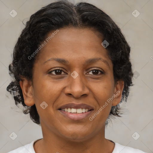 Joyful latino adult female with medium  brown hair and brown eyes