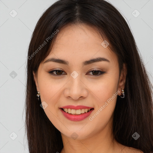 Joyful asian young-adult female with long  brown hair and brown eyes