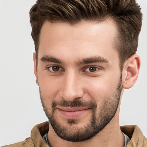 Joyful white young-adult male with short  brown hair and brown eyes