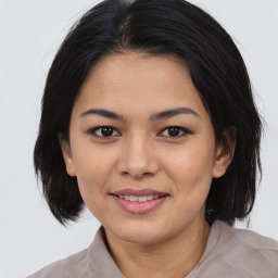 Joyful asian young-adult female with medium  brown hair and brown eyes