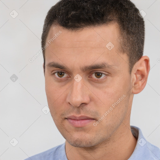 Neutral white young-adult male with short  brown hair and brown eyes