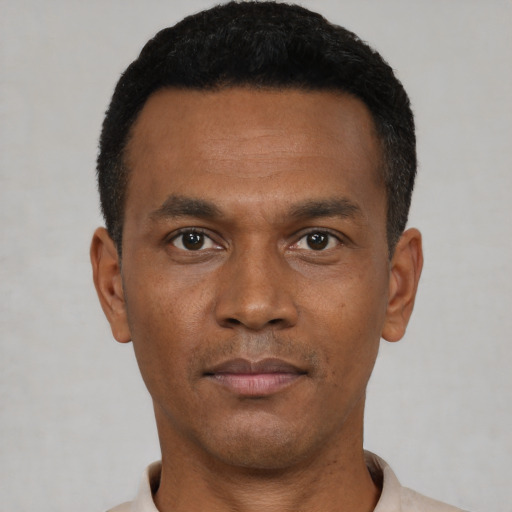 Neutral black young-adult male with short  black hair and brown eyes