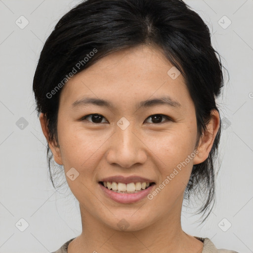 Joyful asian young-adult female with medium  brown hair and brown eyes