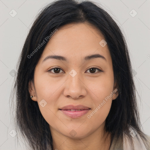 Joyful asian young-adult female with long  brown hair and brown eyes