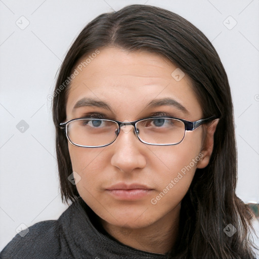 Neutral white young-adult female with long  brown hair and brown eyes