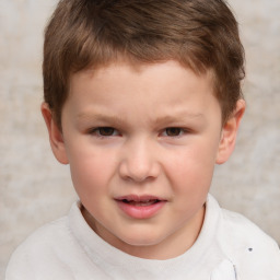 Joyful white child male with short  brown hair and brown eyes