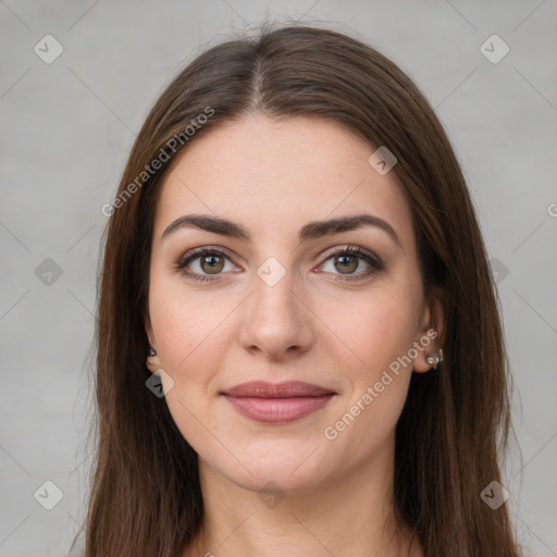 Joyful white young-adult female with long  brown hair and green eyes