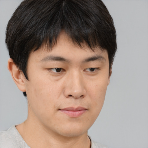 Neutral asian young-adult male with short  brown hair and brown eyes
