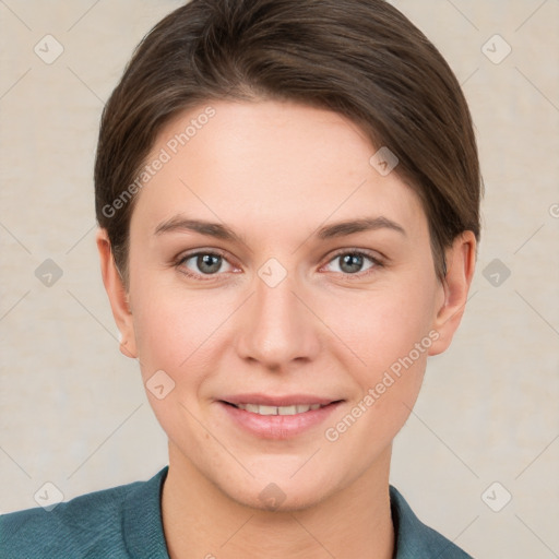 Joyful white young-adult female with short  brown hair and grey eyes