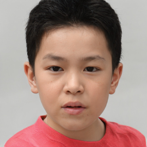 Neutral asian child male with short  brown hair and brown eyes