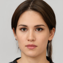 Neutral white young-adult female with medium  brown hair and brown eyes