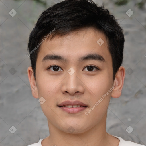 Joyful asian young-adult male with short  black hair and brown eyes