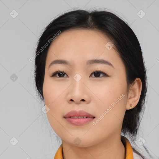 Joyful asian young-adult female with medium  black hair and brown eyes