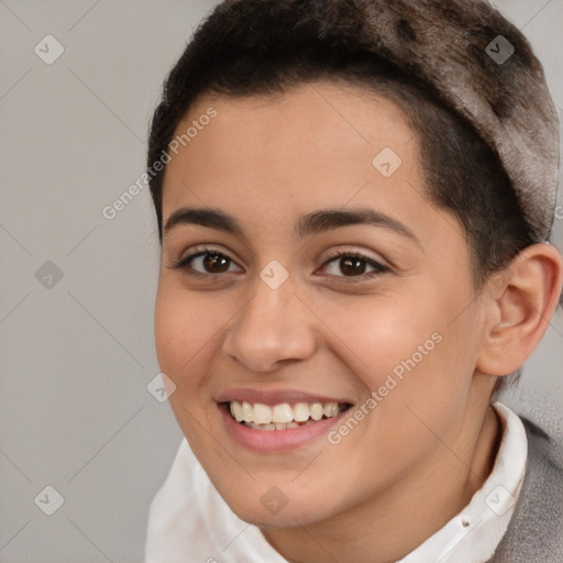 Joyful white young-adult female with short  brown hair and brown eyes