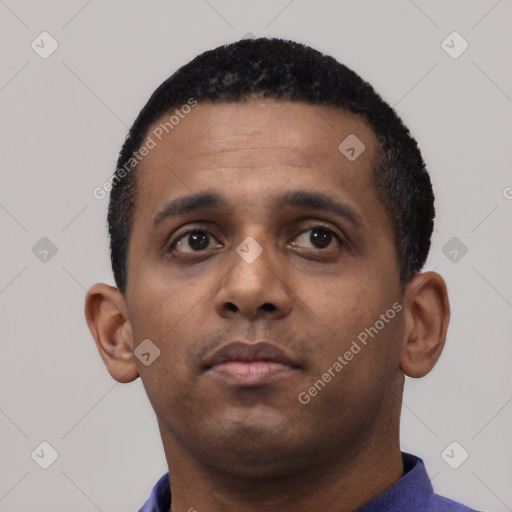 Neutral latino young-adult male with short  black hair and brown eyes