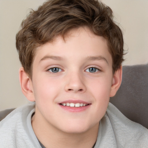 Joyful white child male with short  brown hair and grey eyes