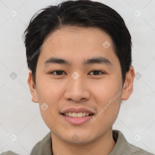 Joyful asian young-adult male with short  brown hair and brown eyes