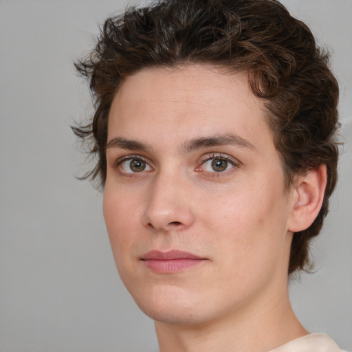 Joyful white young-adult male with medium  brown hair and brown eyes