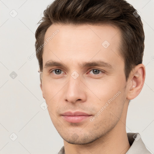 Neutral white young-adult male with short  brown hair and grey eyes