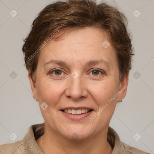 Joyful white adult female with short  brown hair and grey eyes