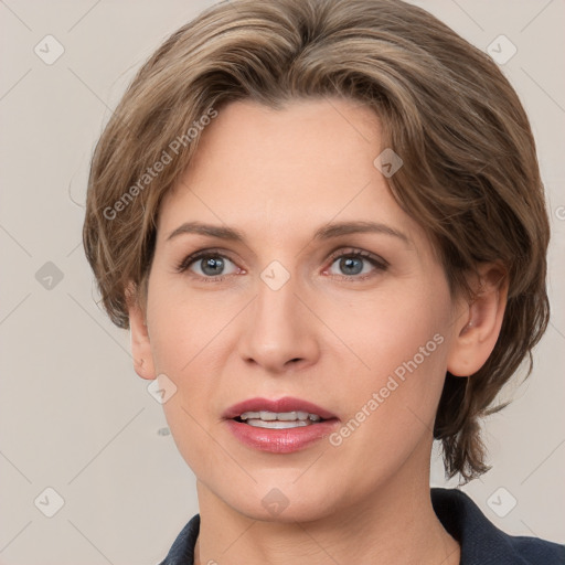 Joyful white adult female with medium  brown hair and grey eyes