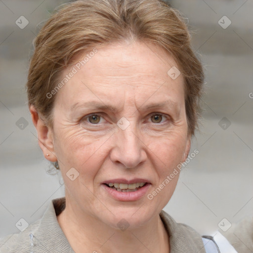 Joyful white adult female with short  brown hair and grey eyes