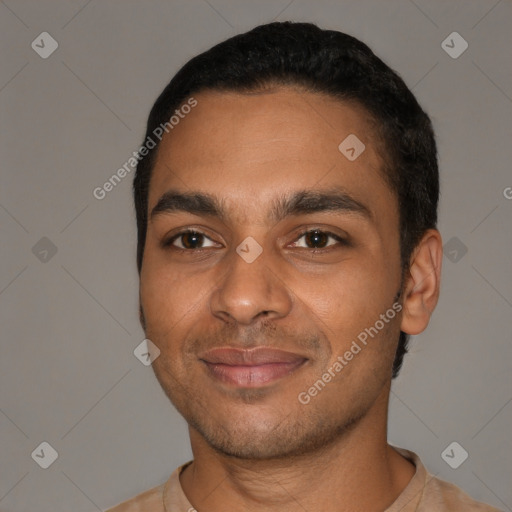 Joyful black young-adult male with short  black hair and brown eyes