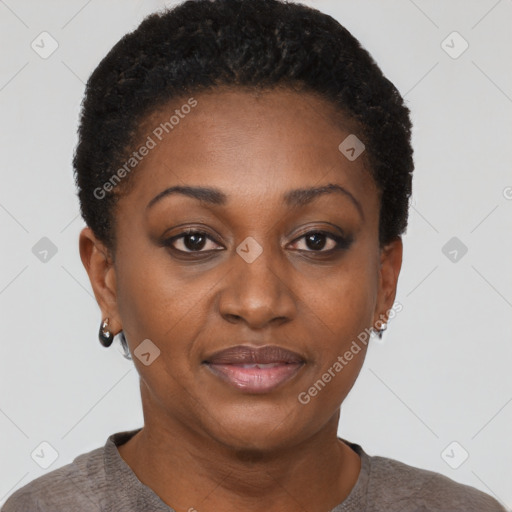 Joyful black young-adult female with short  black hair and brown eyes