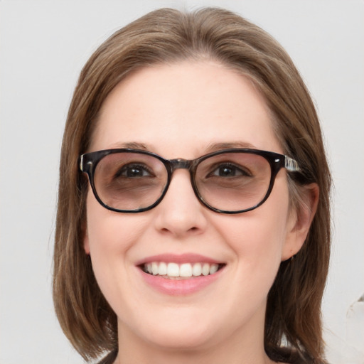 Joyful white young-adult female with medium  brown hair and blue eyes