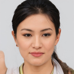 Joyful asian young-adult female with medium  brown hair and brown eyes