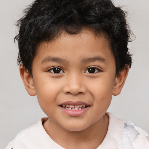 Joyful white child male with short  brown hair and brown eyes