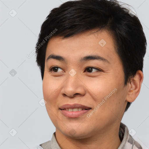 Joyful asian young-adult male with short  brown hair and brown eyes