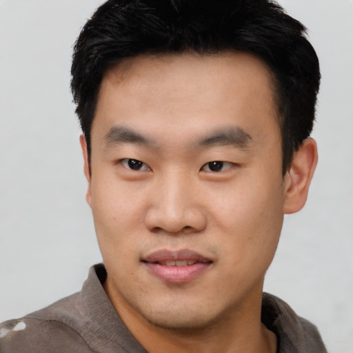 Neutral asian young-adult male with short  black hair and brown eyes