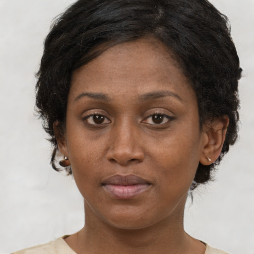 Neutral black young-adult female with short  brown hair and brown eyes