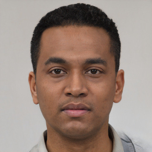 Neutral latino young-adult male with short  black hair and brown eyes