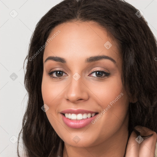 Joyful white young-adult female with long  brown hair and brown eyes