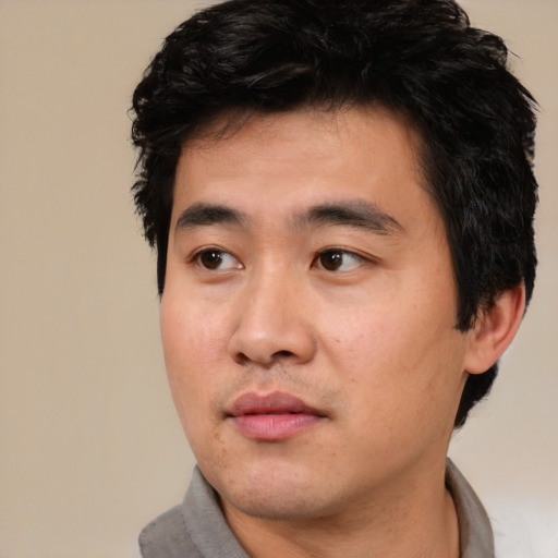 Neutral asian adult male with short  black hair and brown eyes
