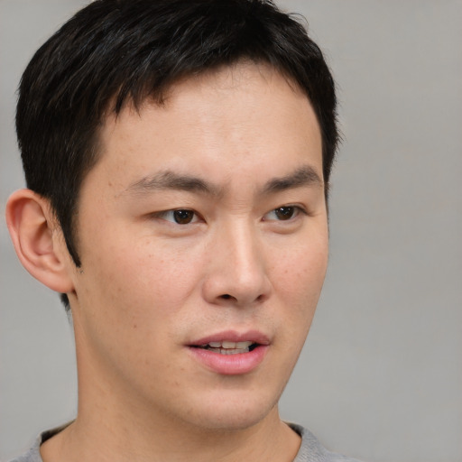Neutral asian young-adult male with short  brown hair and brown eyes