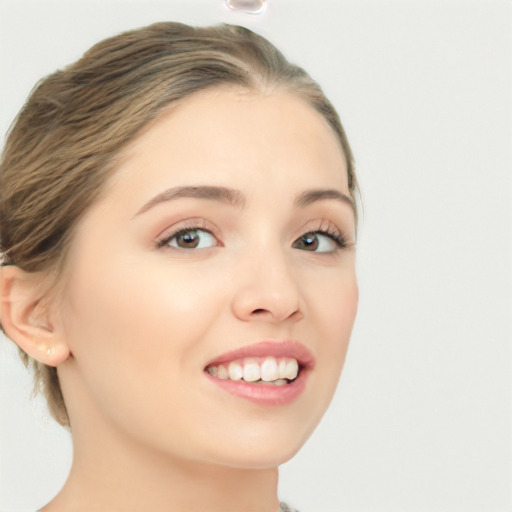 Joyful white young-adult female with medium  brown hair and green eyes