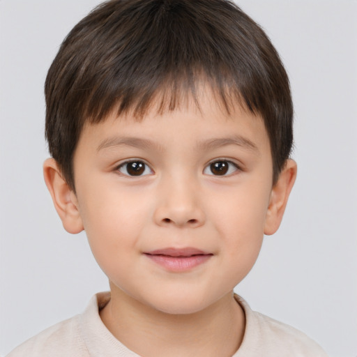 Joyful white child male with short  brown hair and brown eyes