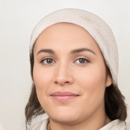 Joyful white young-adult female with medium  black hair and brown eyes