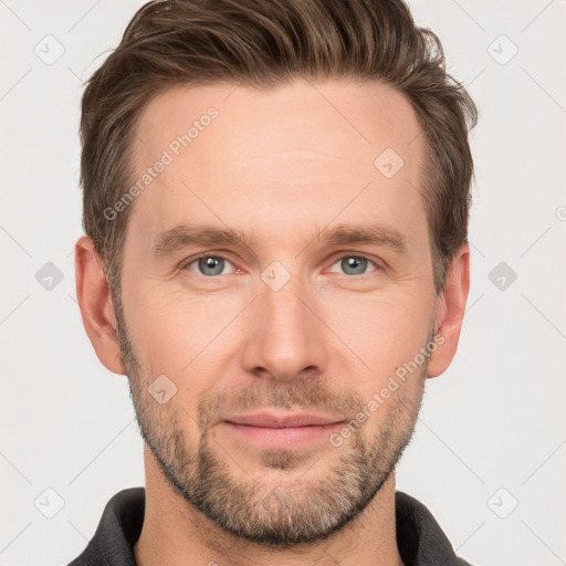 Joyful white adult male with short  brown hair and grey eyes