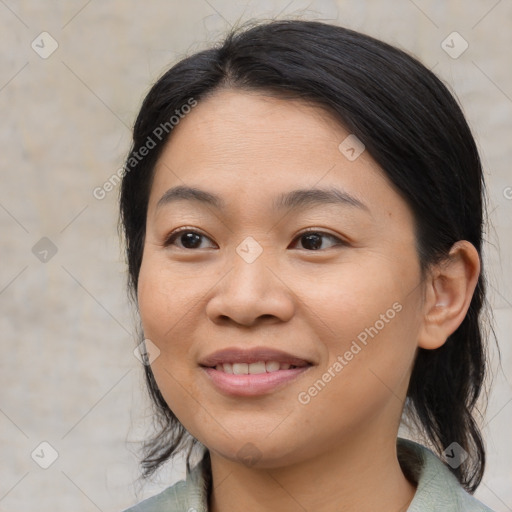Joyful asian young-adult female with medium  brown hair and brown eyes