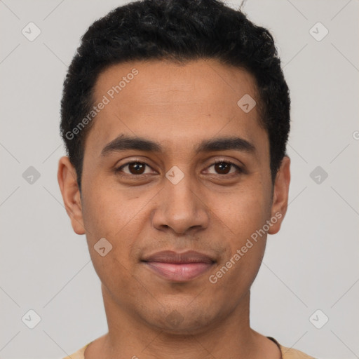 Joyful latino young-adult male with short  black hair and brown eyes