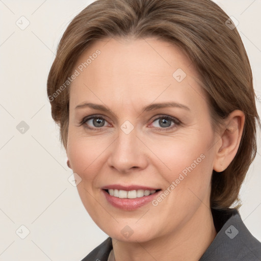 Joyful white adult female with medium  brown hair and grey eyes