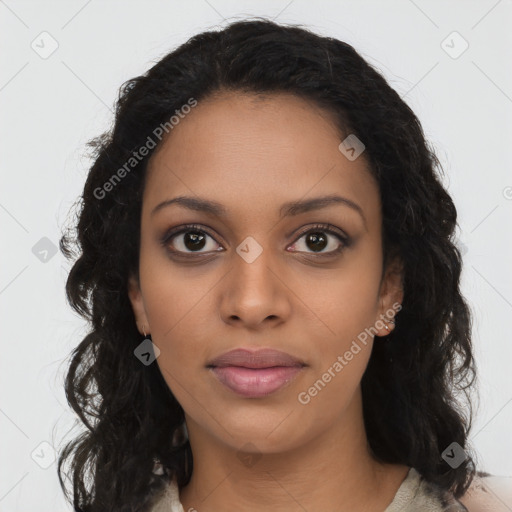 Joyful black young-adult female with long  brown hair and brown eyes